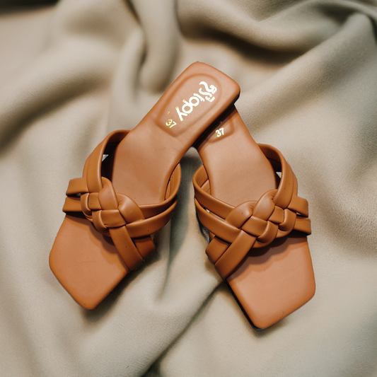 Elegant trendy flat slippers for women displayed on a modern background, stylish footwear ideal for everyday comfort.