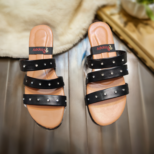 Elegant women’s flat slippers with stud strap design, perfect for casual and formal footwear fashion choices.